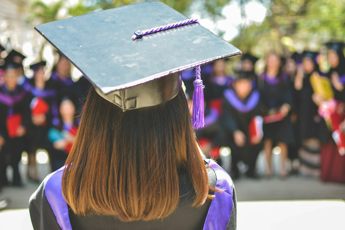 A graduate wearing academic cap and gown at commencement