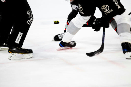 Young ice hockey players competing during a game