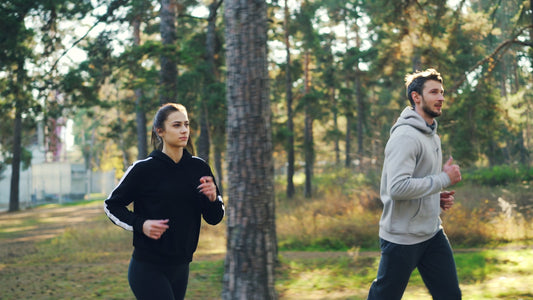 Couple jogging together in a park