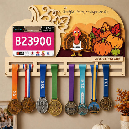 Turkey Trot medal holder – turkey with bib number and pumpkin scene