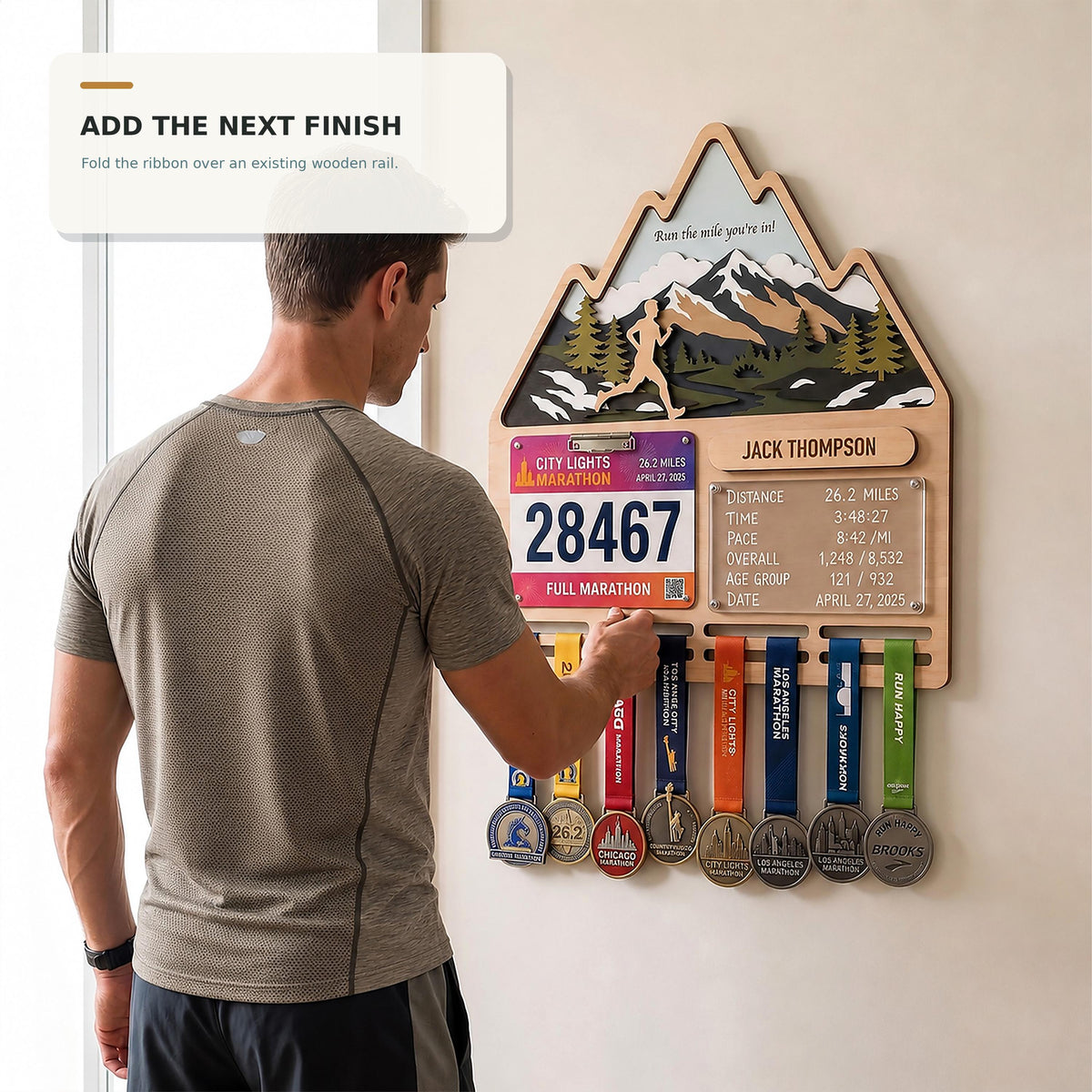 Mountain runner medal holder with race stats board – runner adding a new medal