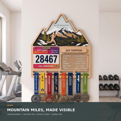 Mountain runner medal holder with race stats board – in a home gym