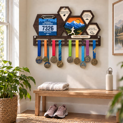 Hexagon race bib and medal holder – bib clip and medals on a hallway wall